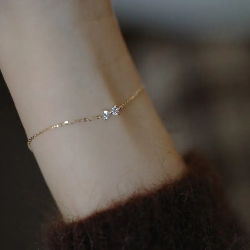Golden Bow Elegance: 925 Sterling Silver Plated 14k Gold Zircon Bow Bracelet