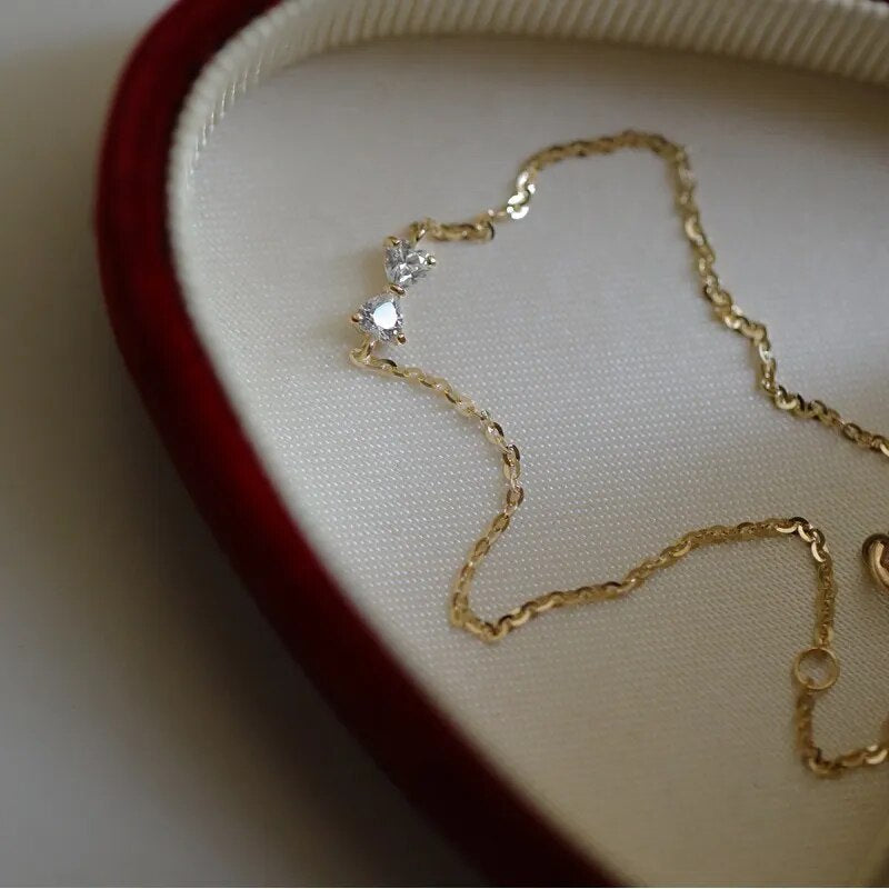 Golden Bow Elegance: 925 Sterling Silver Plated 14k Gold Zircon Bow Bracelet