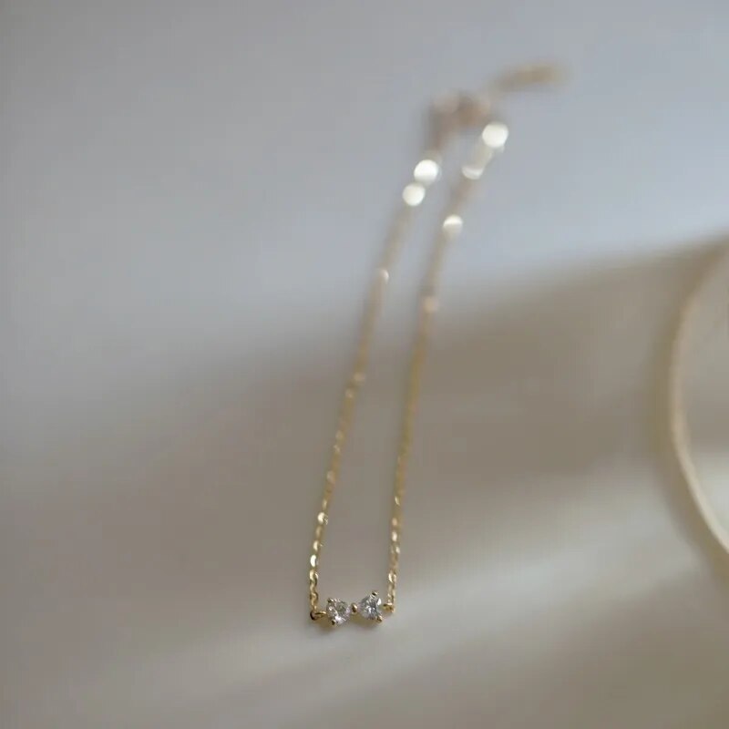 Golden Bow Elegance: 925 Sterling Silver Plated 14k Gold Zircon Bow Bracelet